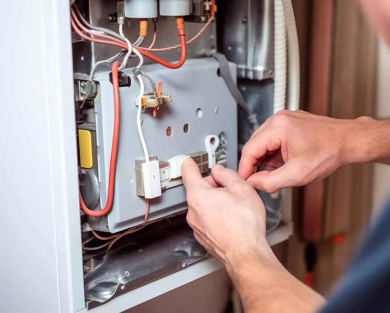 Plumber working on furnace